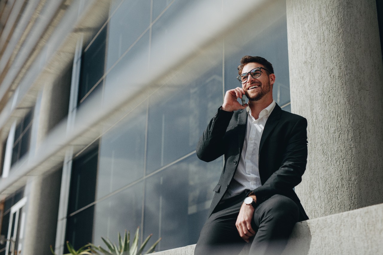 Man using smart phone in modern office